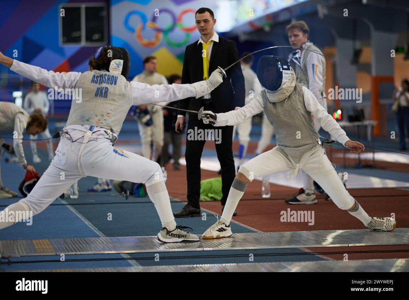 Fencers fighting with swords at the National Fencing Championship of