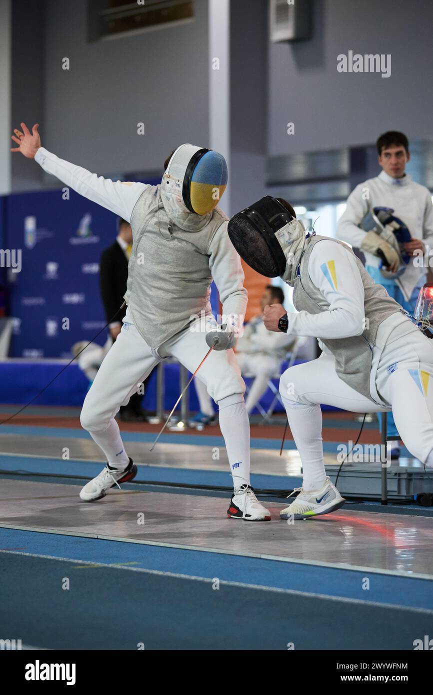Epee fencers compete on the track at the National Fencing Championship