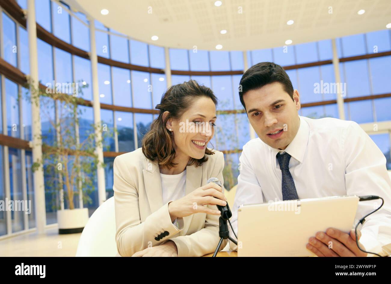 Executives with digital tablet, video conference. Stock Photo
