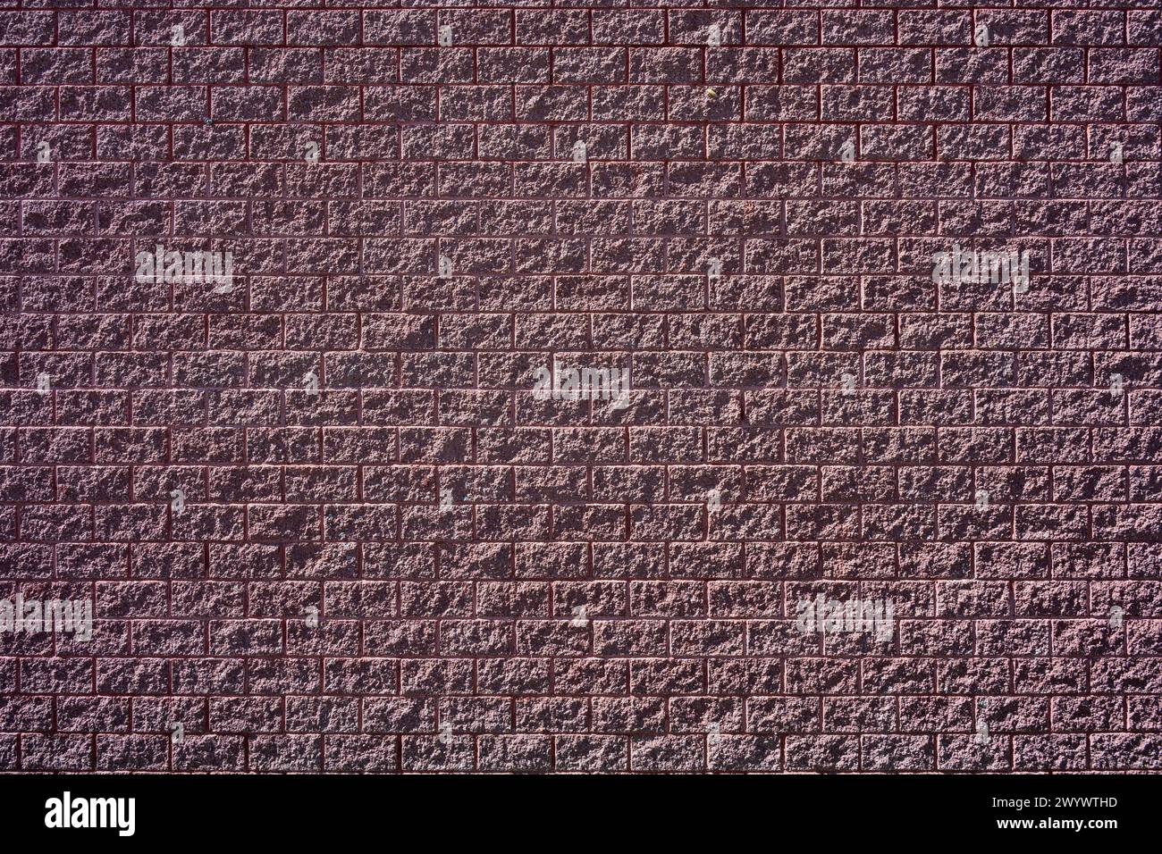 Background from a dark red brick wall Stock Photo