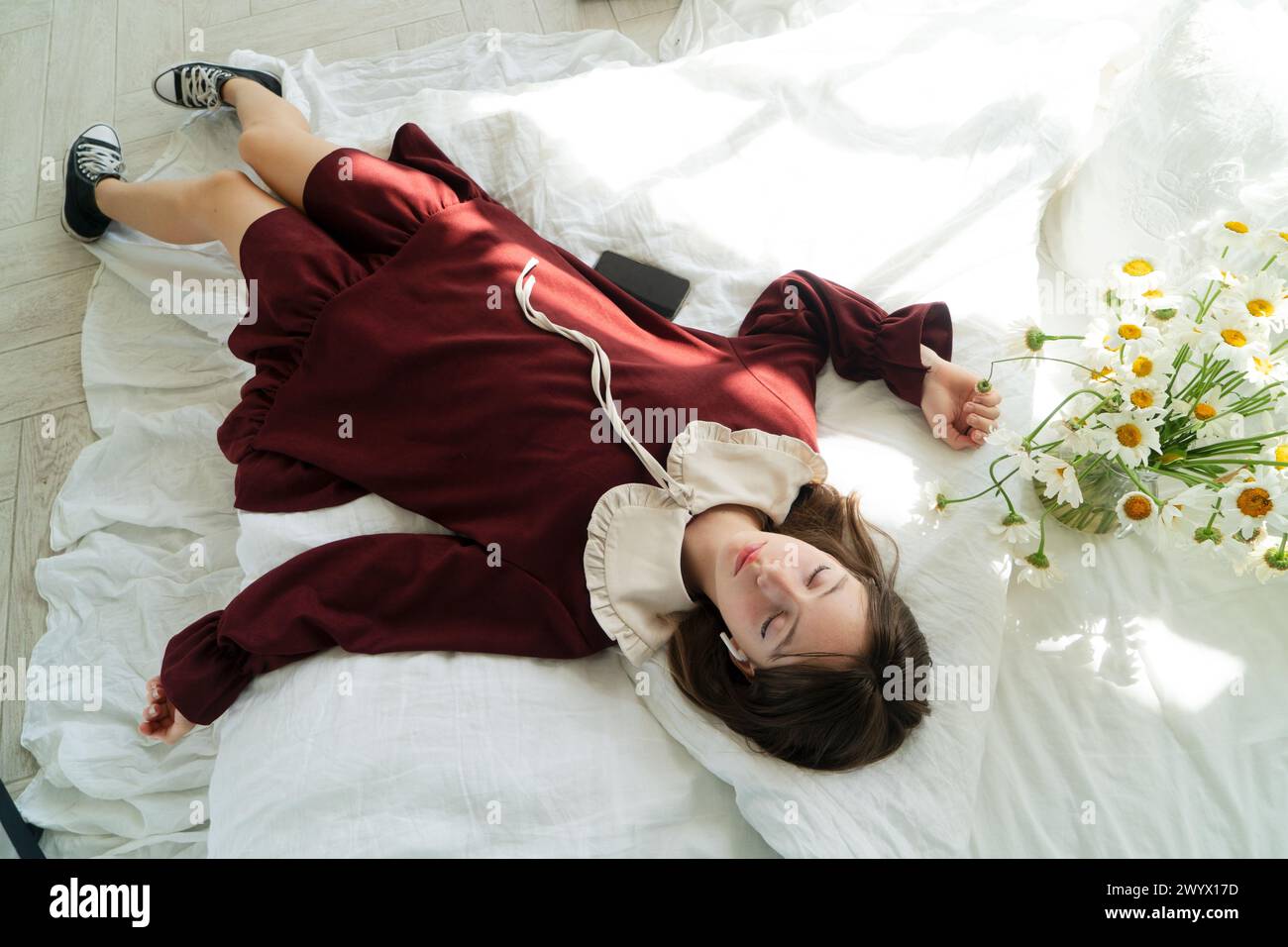 Girl lying on bed flower hi-res stock photography and images - Alamy