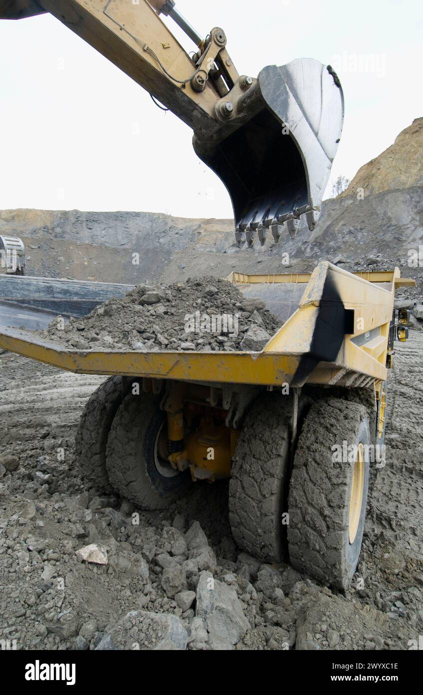 Loading rocks at quarry, Hydraulic Excavator, machinery for public ...