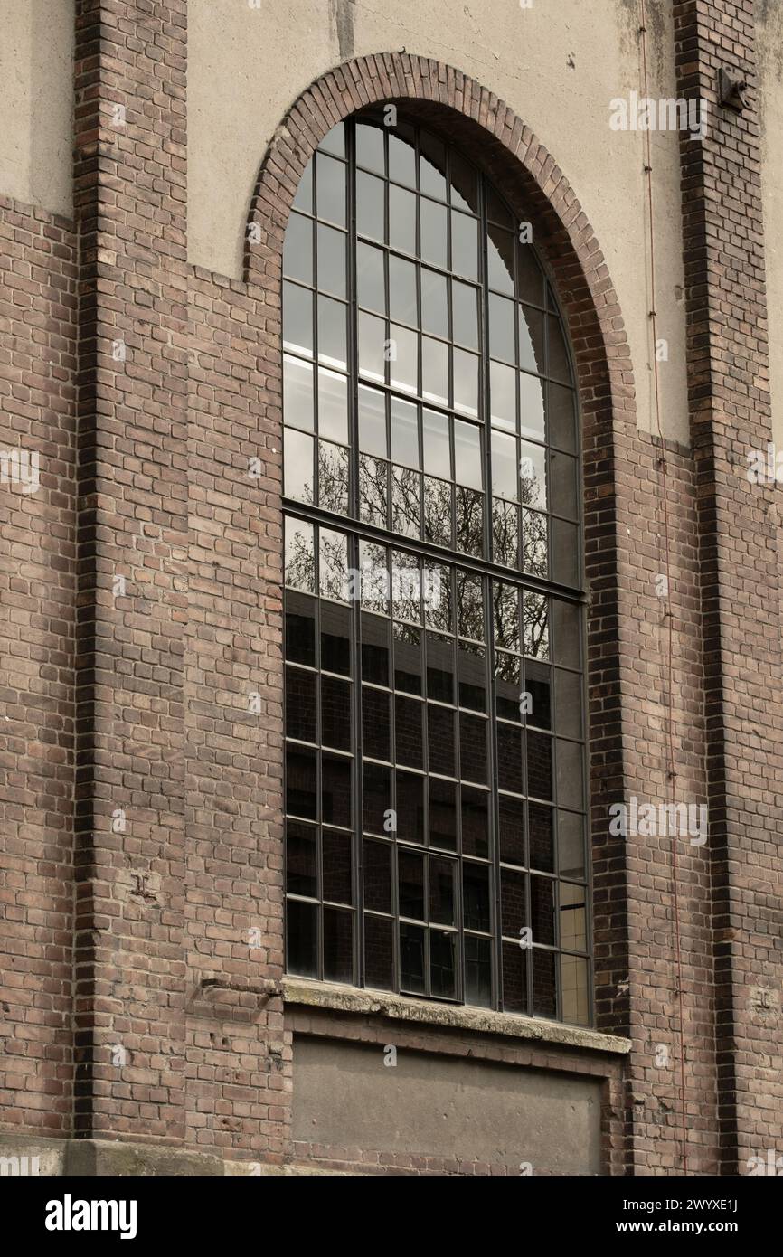Details of an old industrial building, brick wall and windows, approx. 100 years old Stock Photo