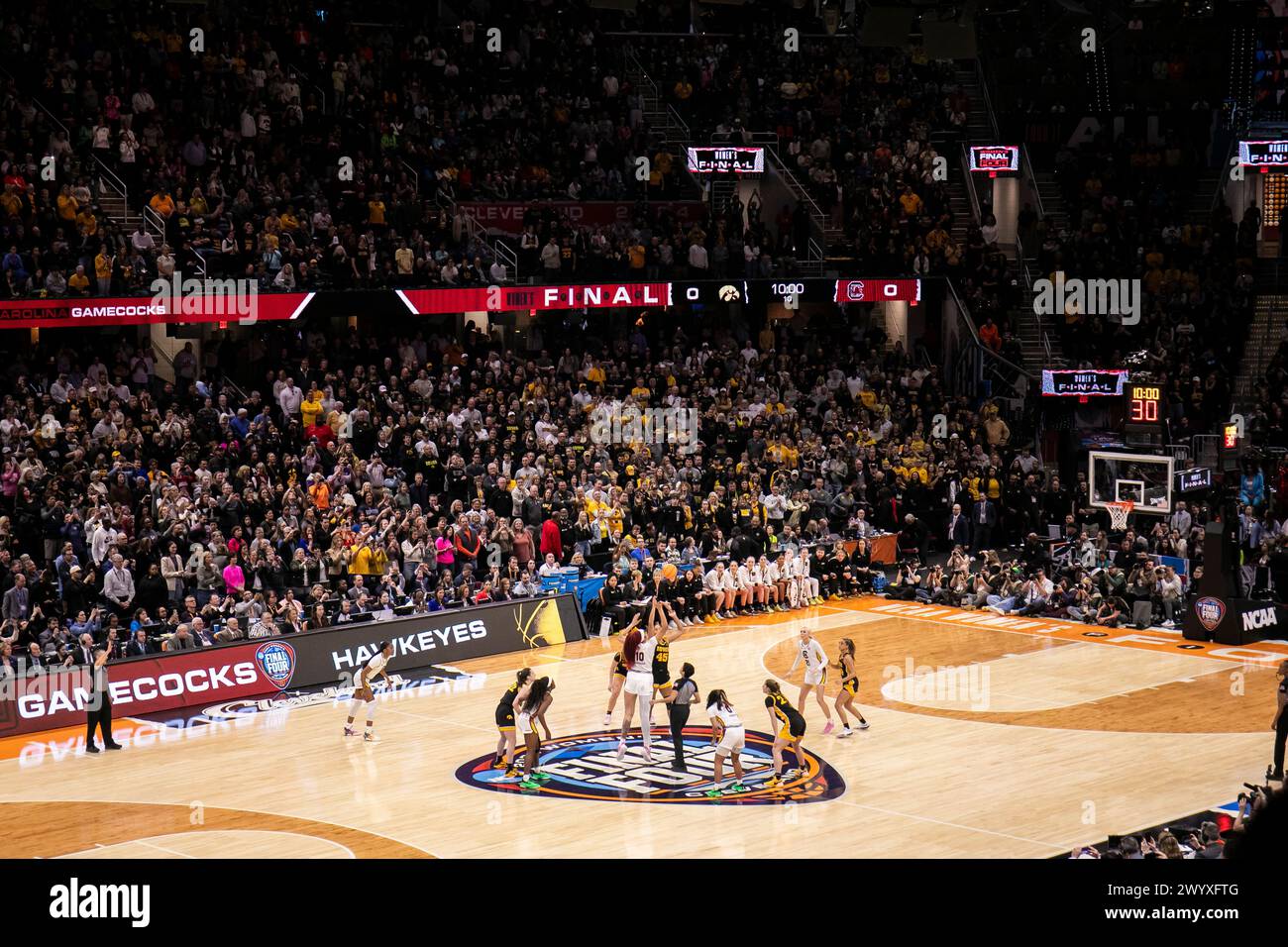 Cleveland, Ohio, USA. 7th April, 2024. Tip off of final game between the South Carolina Gamecocks and the Iowa Hawkeyes in the NCAA Women’s Final Four tournament at Rocket Mortgage FieldHouse in Cleveland, Ohio. (Kindell Buchanan/Alamy Live News) Stock Photo