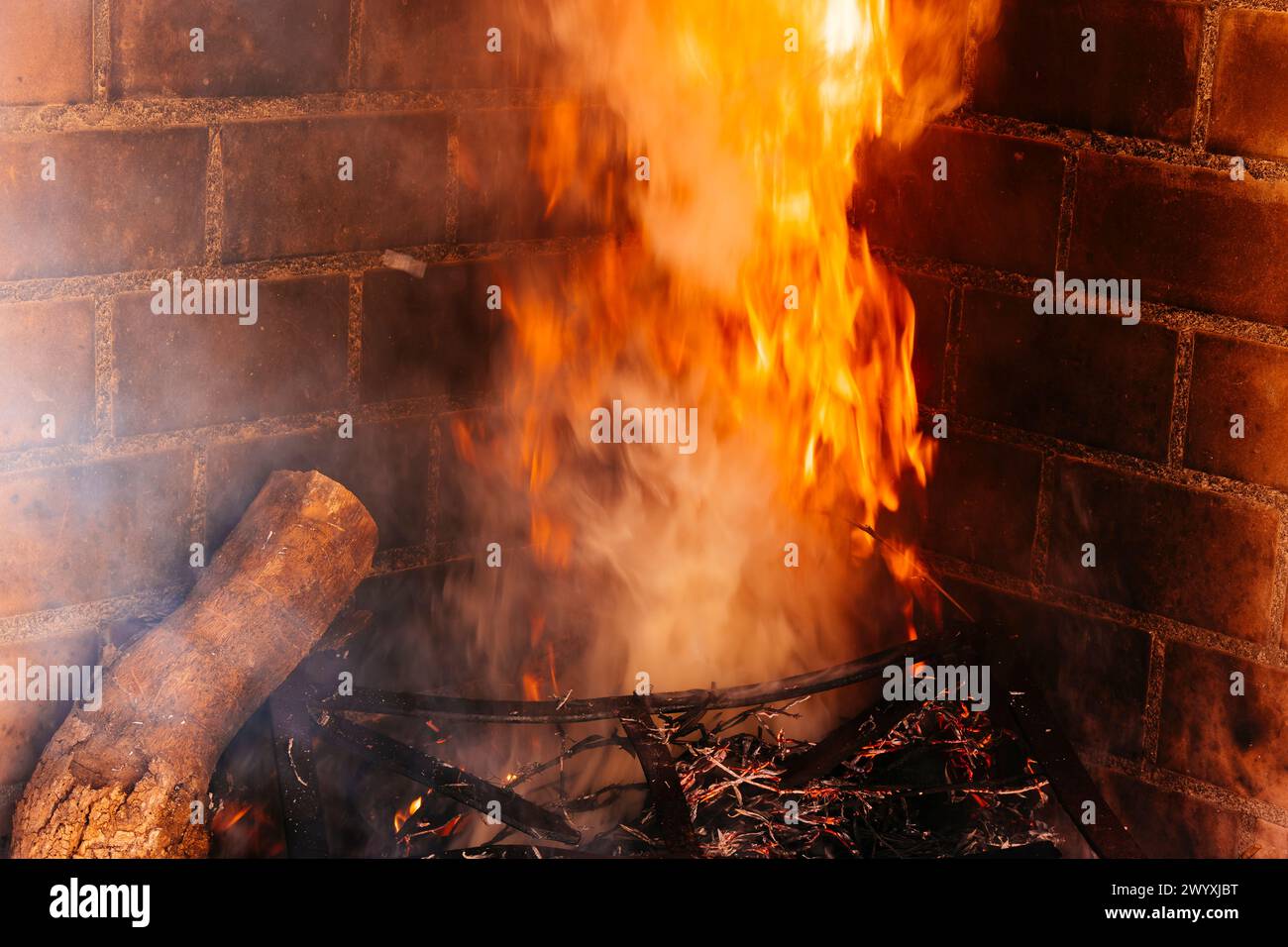 Logs burning in the fireplace. Jaén, Andalucía, Spain, Europe Stock Photo