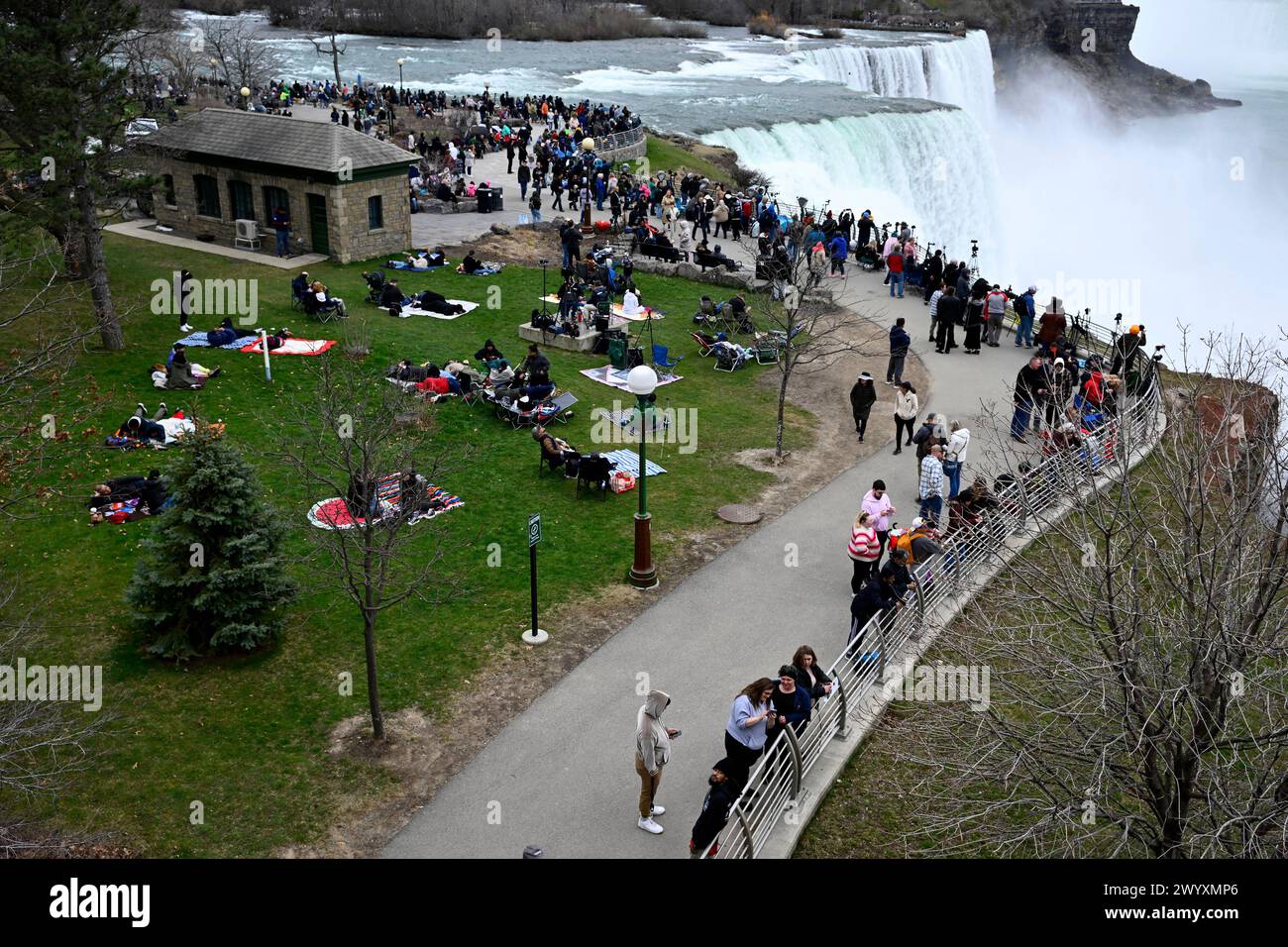 Crowds gather to view the solar eclipse at the Niagara Falls State Park ...