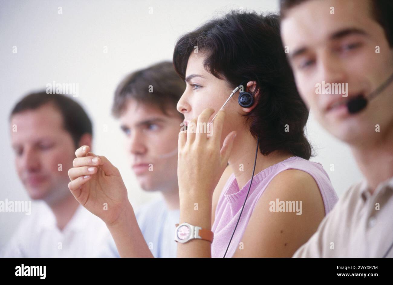 Young people with headsets. Stock Photo