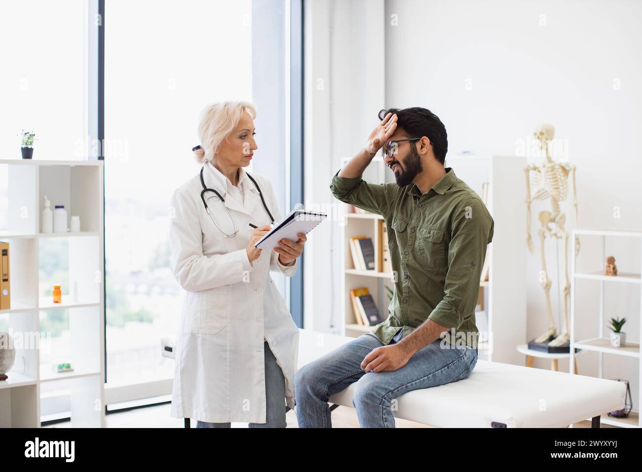 Doctor giving lady prescription hi-res stock photography and images - Alamy