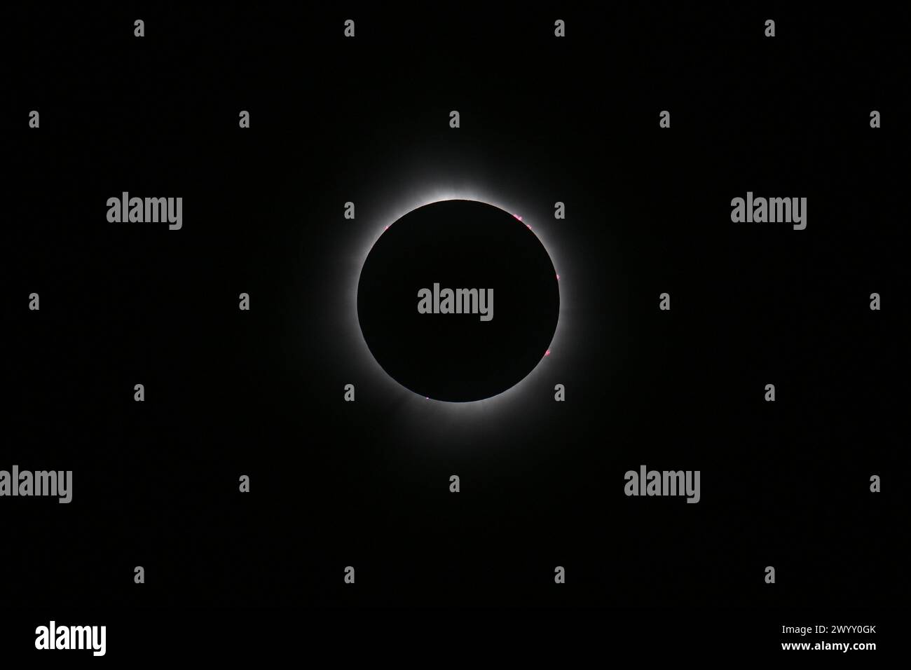 The moon completely crosses in front of the sun creating a total solar