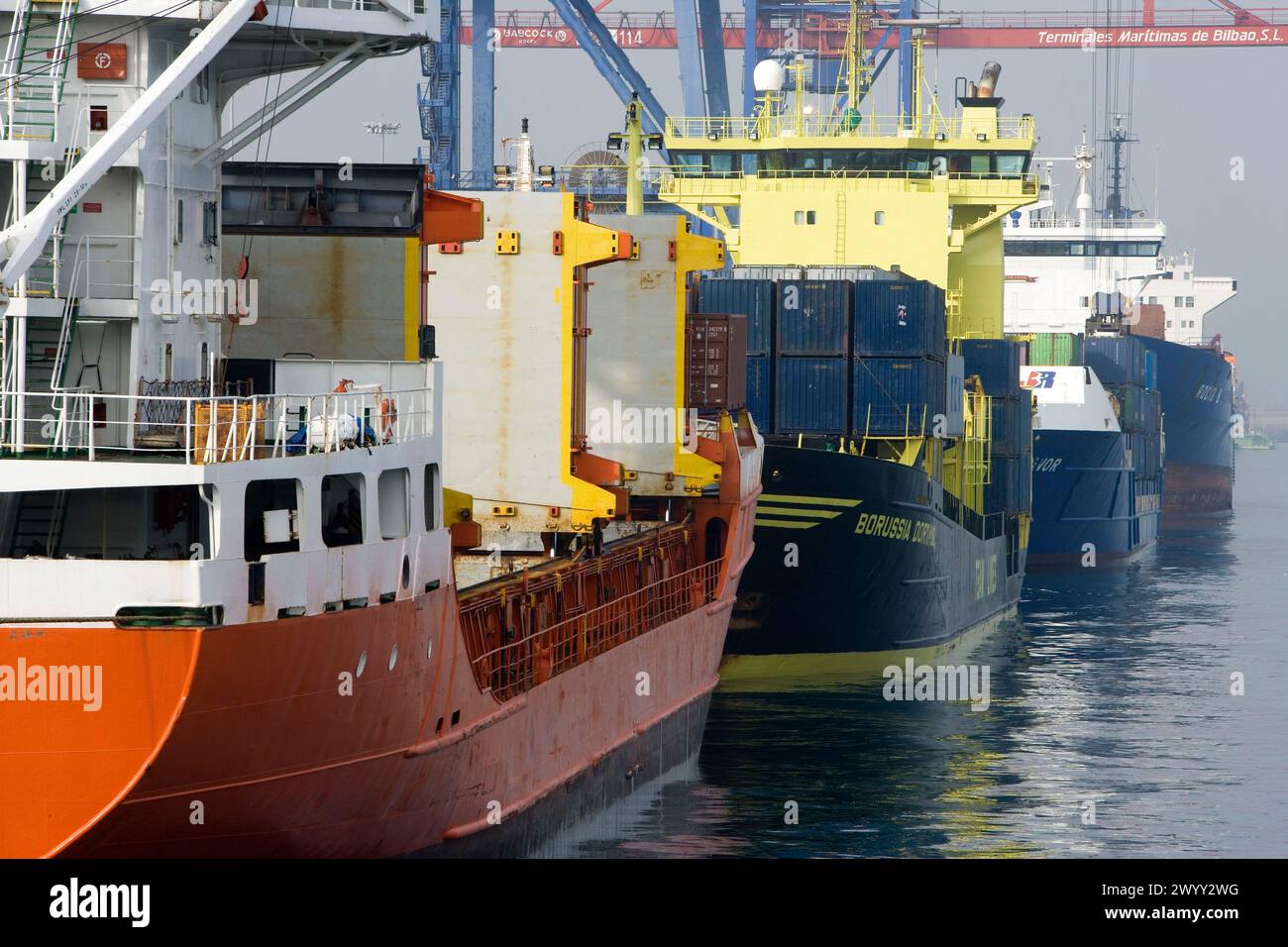 Loading cargo ships, Port of Bilbao, Santurtzi. Biscay, Euskadi, Spain. Stock Photo