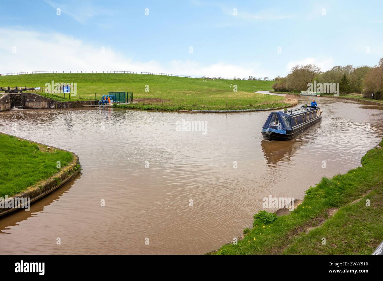 Canal narrowboat on the Shropshire Union canal heading South past the junction with the Llangollen canal at Hurleston junction near Nantwich Cheshire Stock Photo
