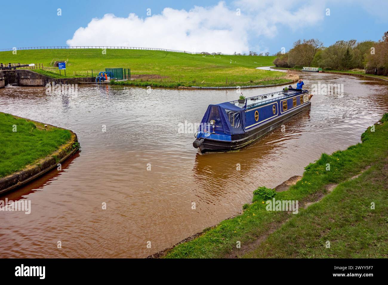 Canal narrowboat on the Shropshire Union canal heading South past the junction with the Llangollen canal at Hurleston junction near Nantwich Cheshire Stock Photo