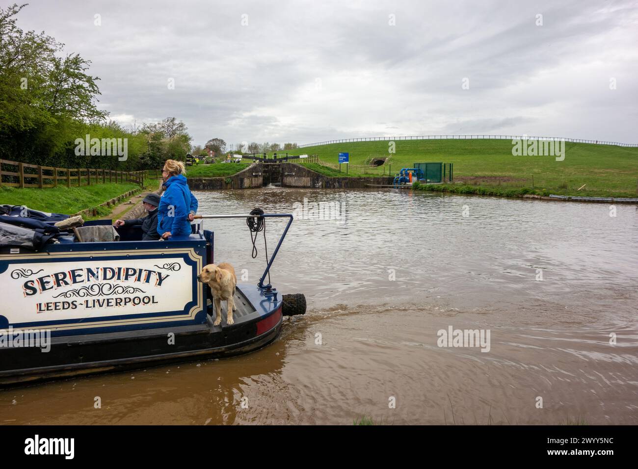 Canal narrowboat on the Shropshire Union canal heading South past the junction with the Llangollen canal at Hurleston junction near Nantwich Cheshire Stock Photo