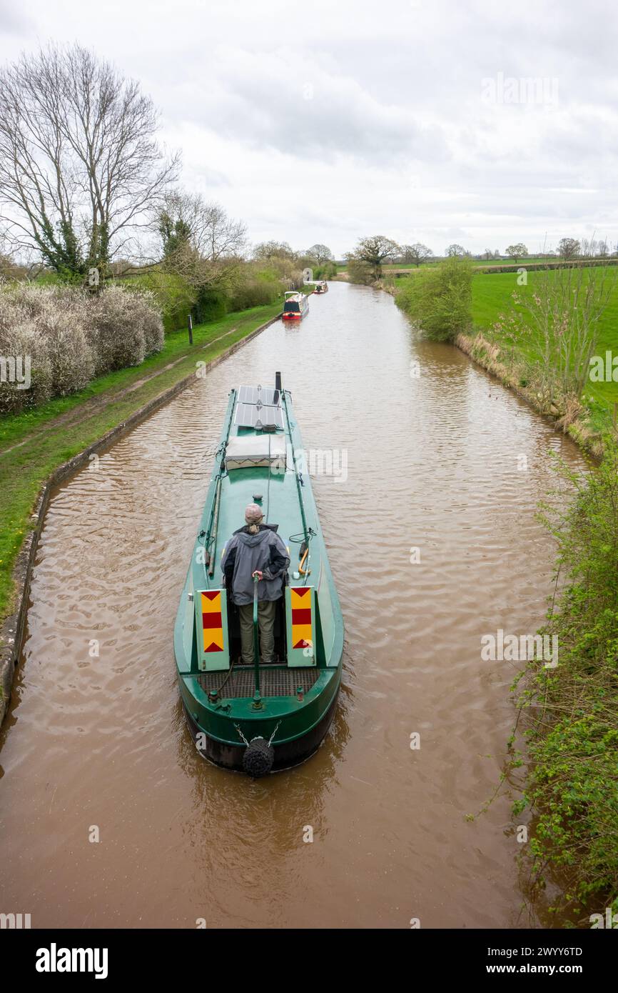 Narrowboat heading south on the Shropshire union canal after emerging out of the Llangollen canal at Hurleston junction Cheshire England Stock Photo