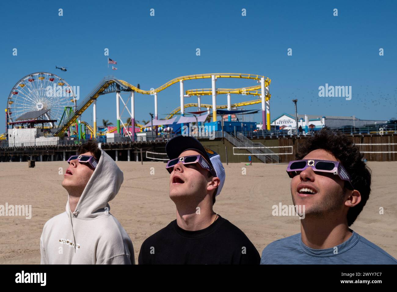 Massimo Soto, Kyle Lotke, and Casey Bajec observe a partial solar
