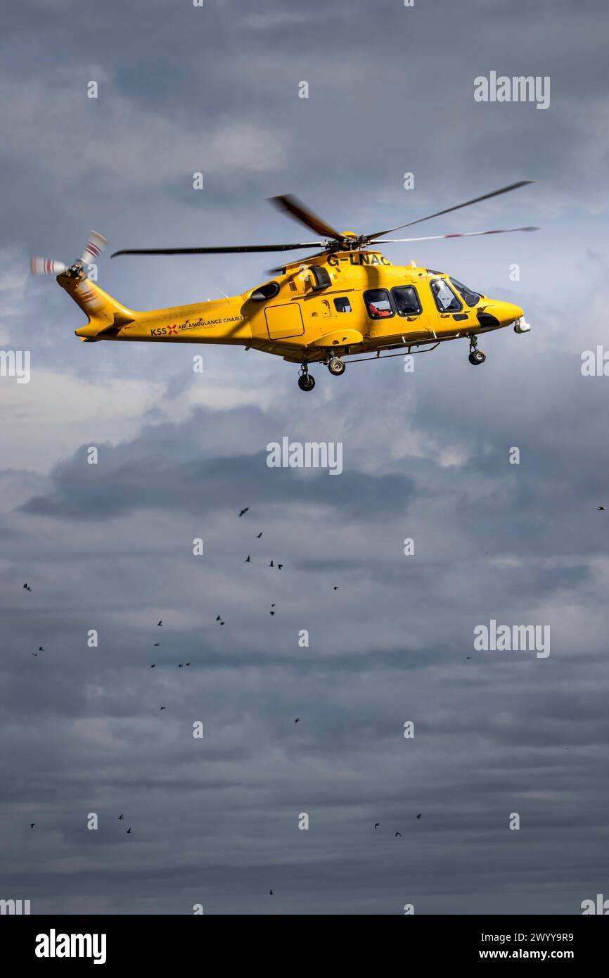 Air ambulance departs scene of traffic accident with casualty on board Stock Photo