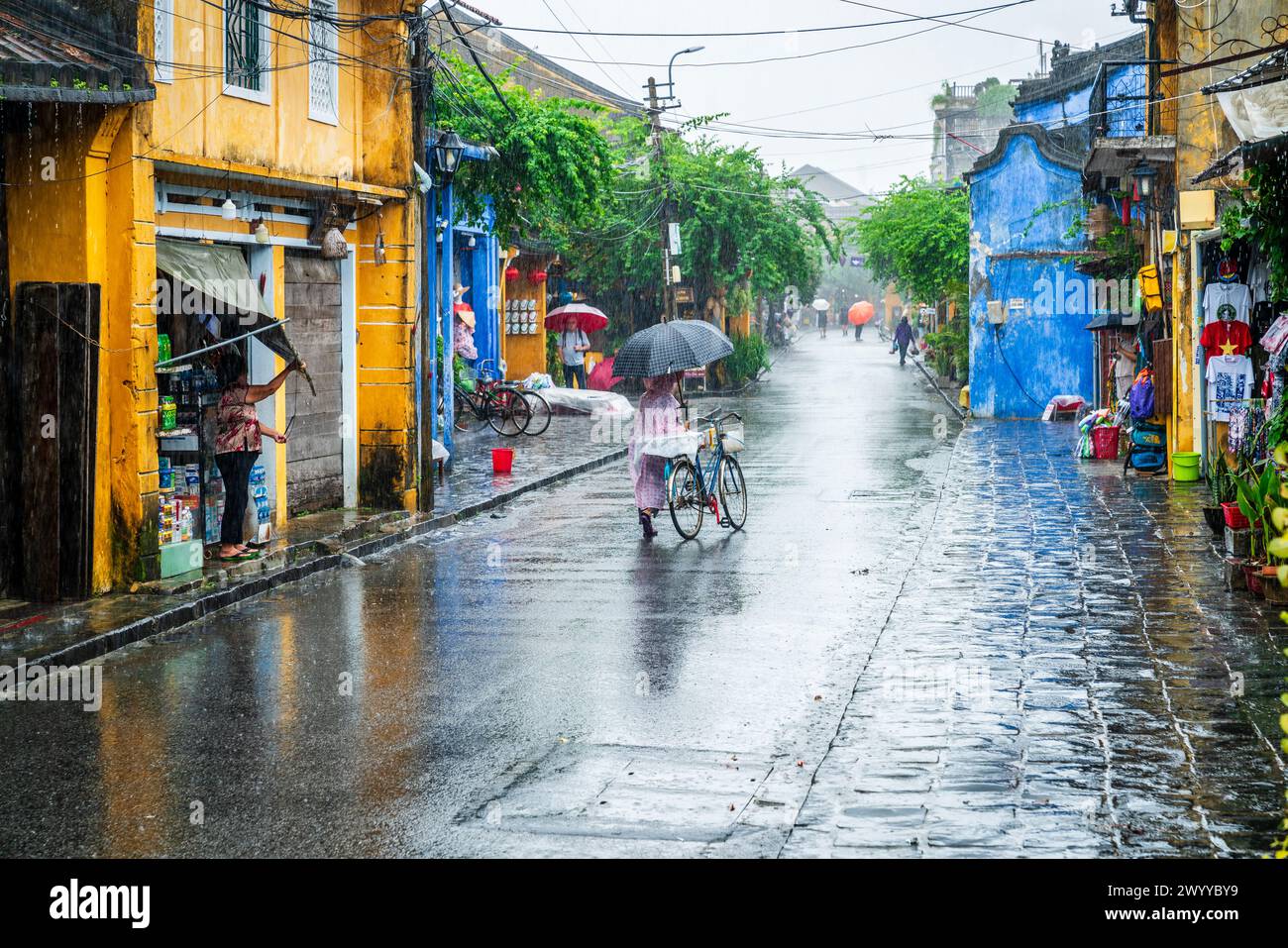 Hoi An, Vietnam, November 21, 2022: Street scene in the old town of Hoi An, Vietnam on a rainy day Stock Photo