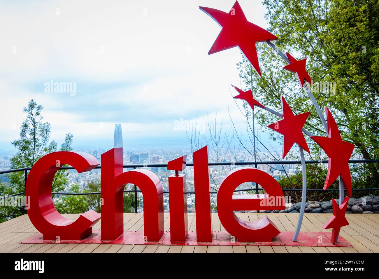 Santiago, Chile, September 18, 2022: Chile sign with Santiago skyline in the backdrop at Cerro San Cristobal park. Stock Photo