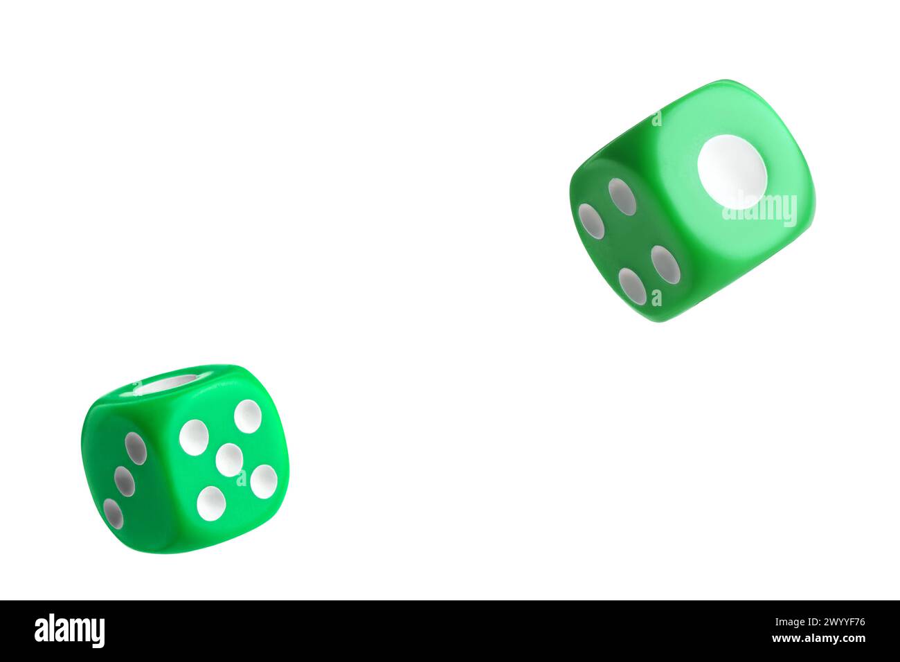 Two green dice in air on white background Stock Photo