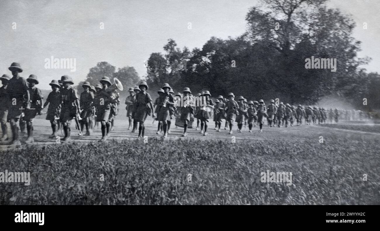 Soldiers of the 2nd Battalion The Queen's Royal Regiment (West Surrey) headed by a band marching along the road from Allahabad, British India, c. mid 1920s. Stock Photo