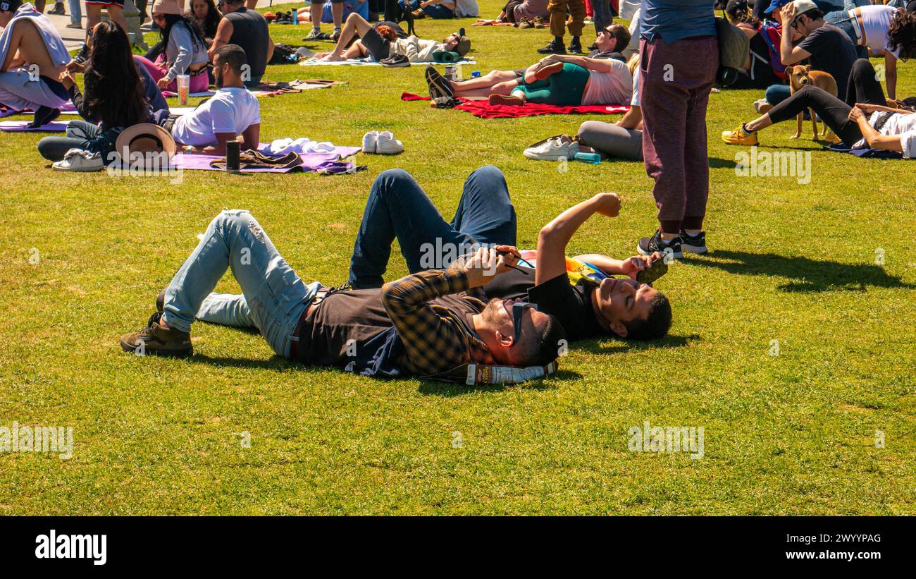 People watching the 2024 solar eclipse in Griffith Park, Los Angeles