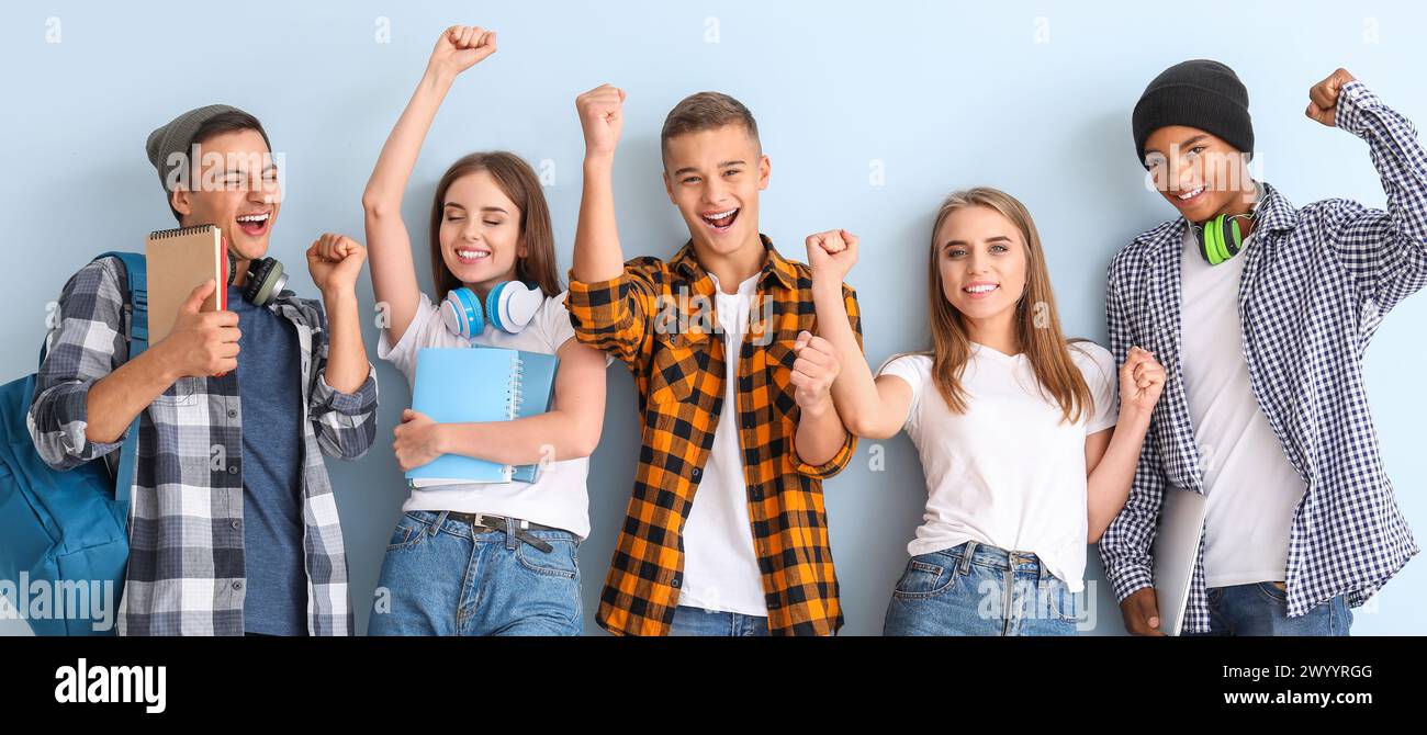Portrait of happy young students on light background Stock Photo - Alamy