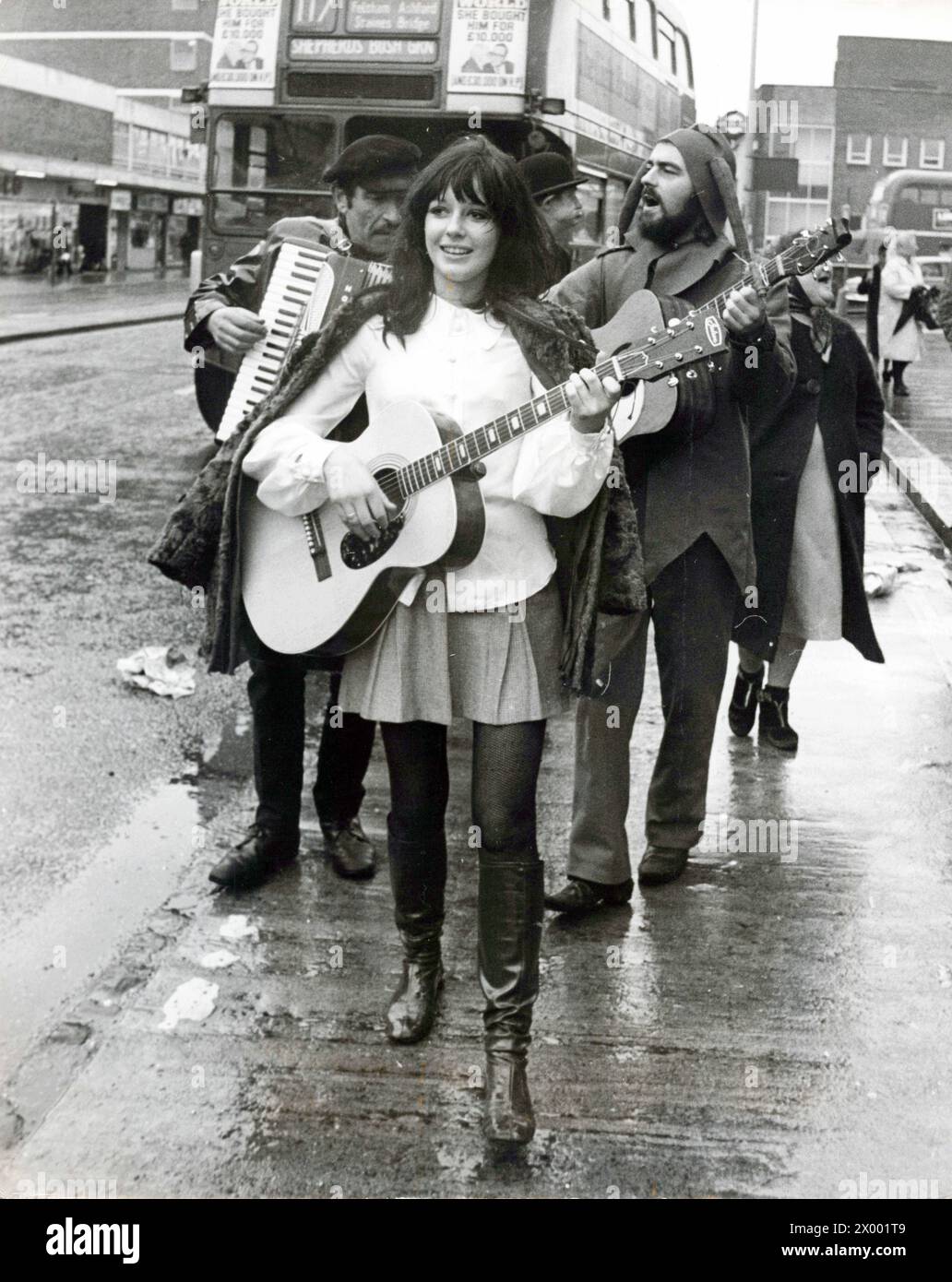 January 13, 1969: London, England, United Kingdom: SUSAN KEELEY, who hitch-hiked from Los Angeles, California to get to Britain across the continent, wrote a song called Following Your Fancy, mean leading the bunkers at all impromptu rehearsal in Hounslow today. (Credit Image: © Keystone Press Agency/ZUMA Press Wire). EDITORIAL USAGE ONLY! Not for Commercial USAGE! Stock Photo