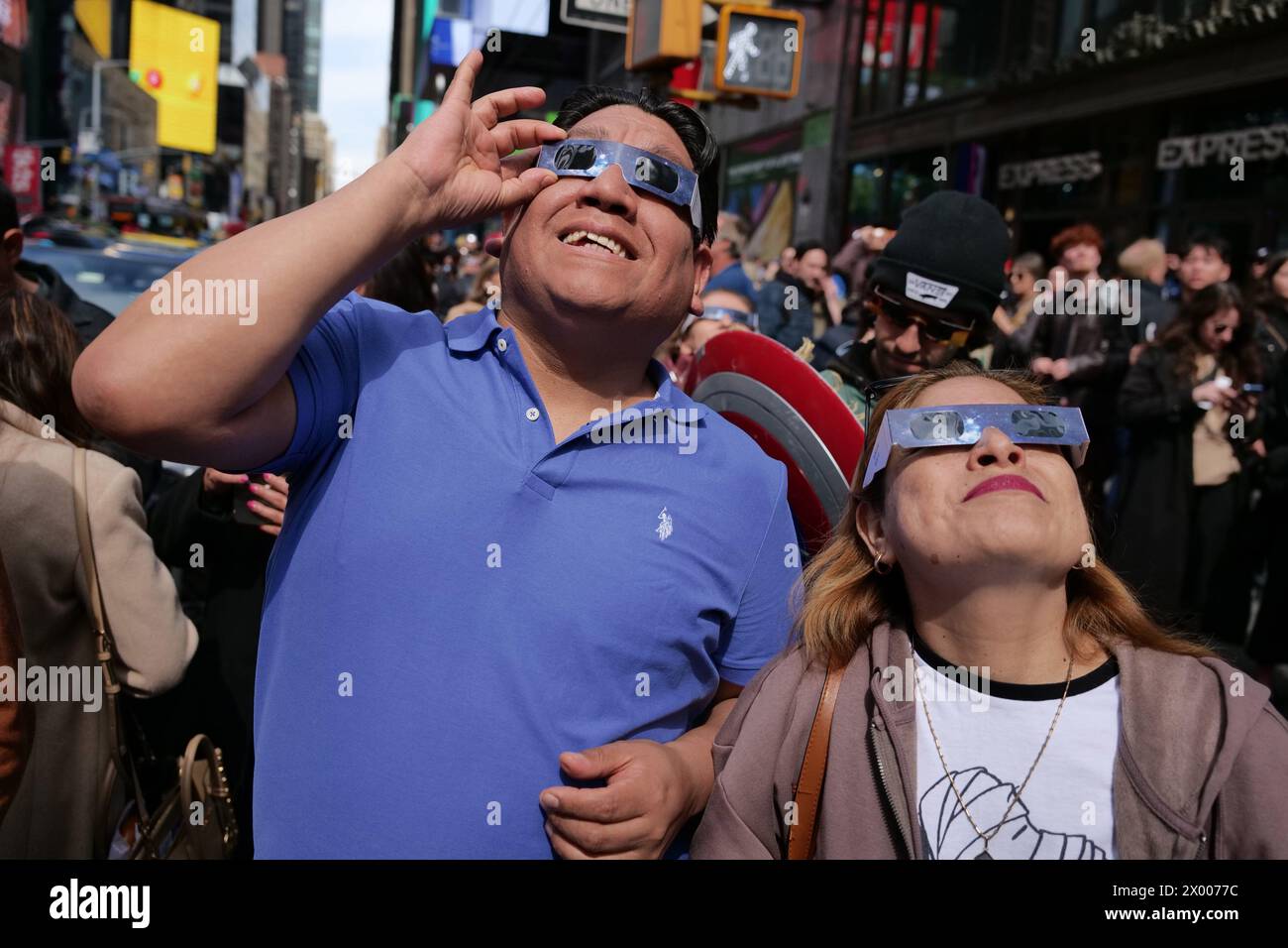 New York, New York, USA. 8th Apr, 2024. Solar Eclipse as seen from the crossroads of the world Times Square. Day turned into night across the NYC area as thousands were in awe watching the solar miracle. Streets were one big astral viewing party as the 2 plus hours skywatch was a once in a lifetime opportunity for much of the population. (Credit Image: © Milo Hess/ZUMA Press Wire) EDITORIAL USAGE ONLY! Not for Commercial USAGE! Stock Photo