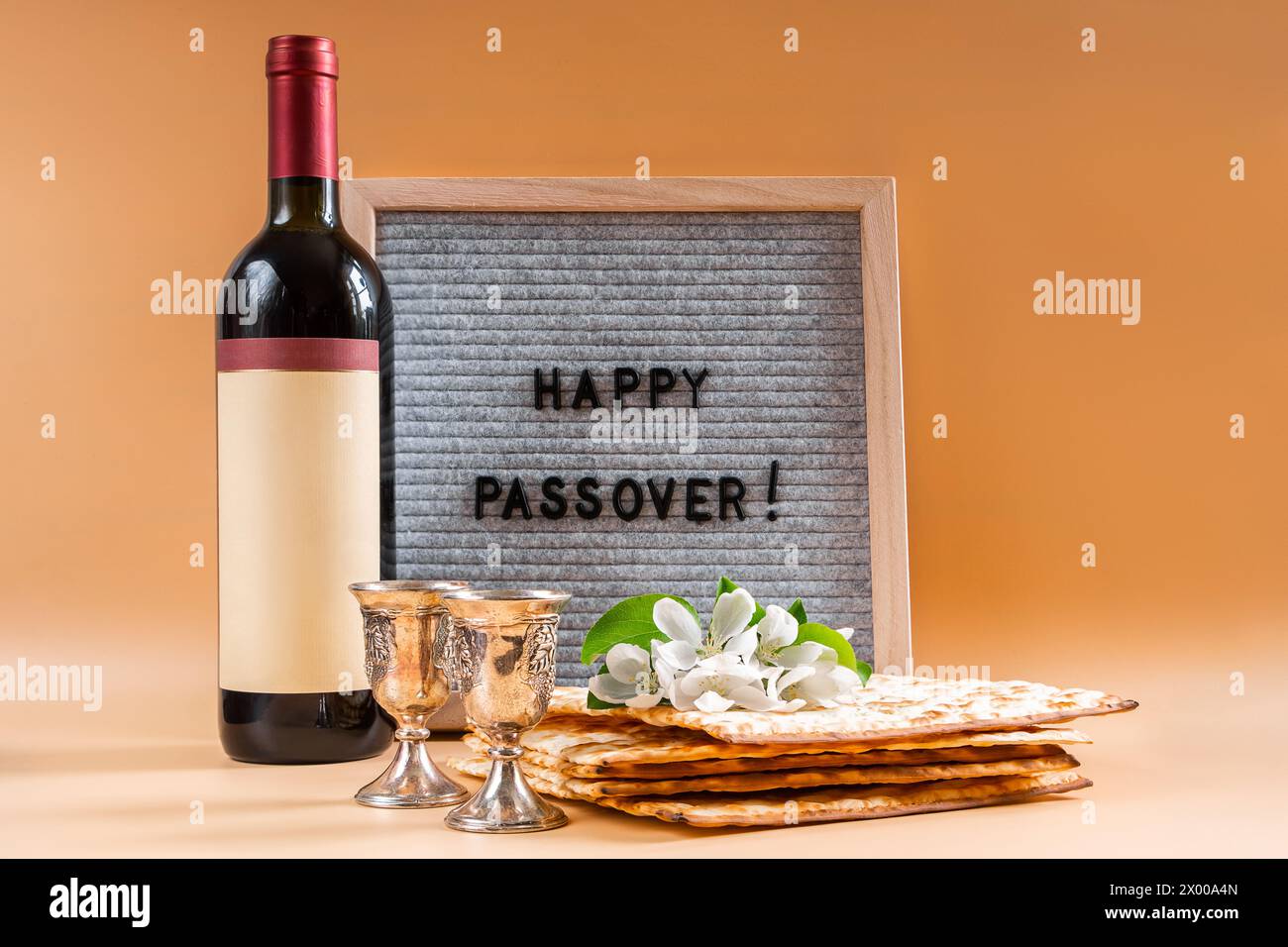 Jewish holiday Passover. Bottle of wine, spring flowers and matzah ...