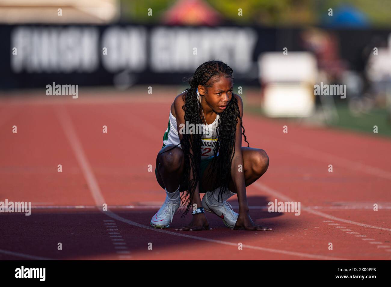 Alaya Graves-Hogains of Canyon rests after finishing the seeded 400 meter dash during the 56th Arcadia Invitational high school track meet, Saturday, Stock Photo