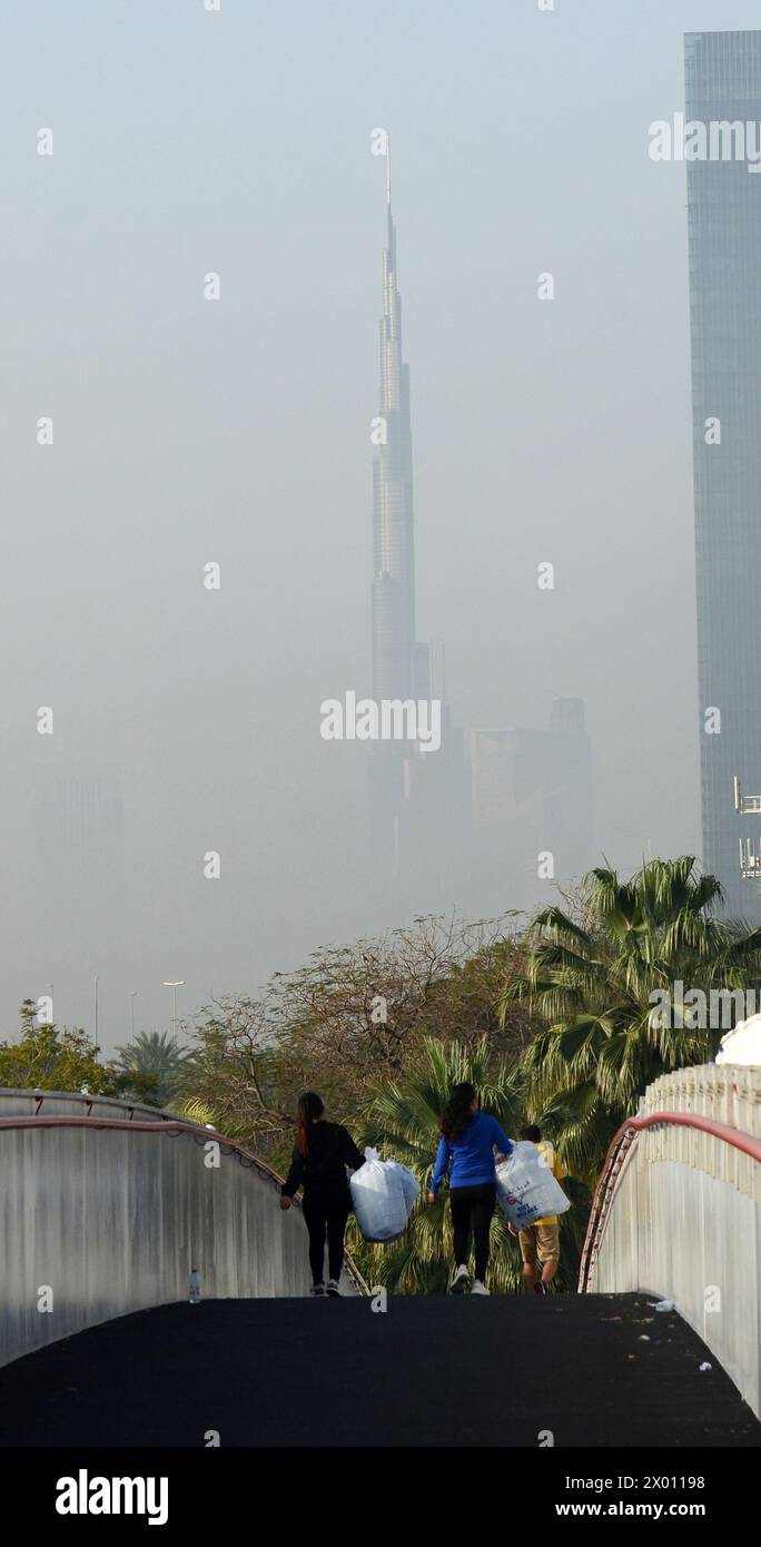 The Burj Khalifa skyscraper in a morning mist. Dubai, UAE. Stock Photo
