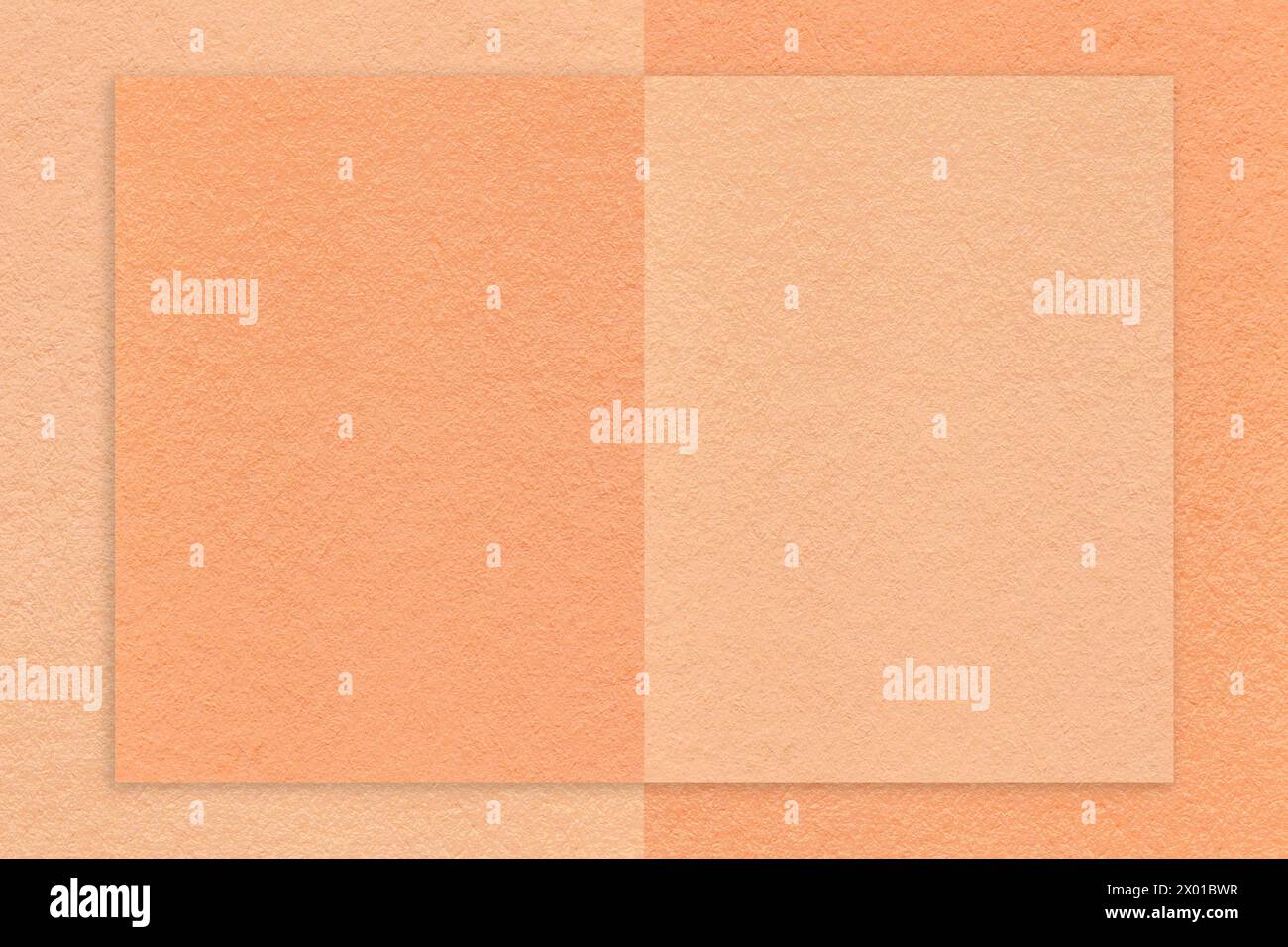 Color of year 2024. Texture of peach fuzz and coral paper background with geometric shape and pattern, macro. Structure of craft cardboard with frame. Stock Photo