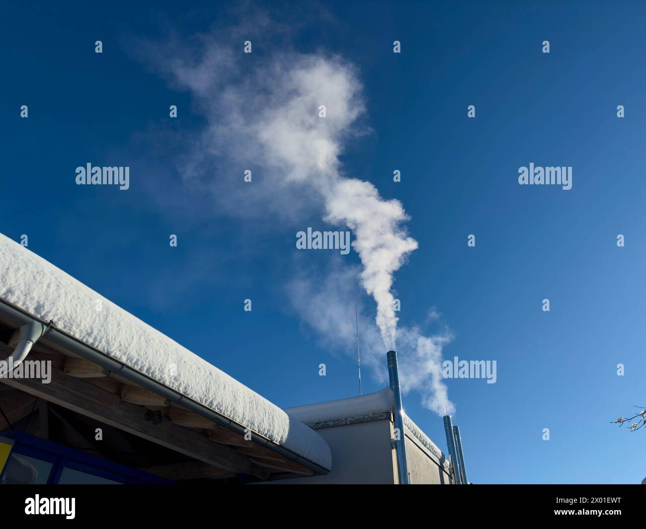 Smoking chimneys in a cold winter day in Marktoberdorf, Allgaeu, Bavaria, Germany, Feb 24, 2024.  Photographer: ddp images / star-images Stock Photo