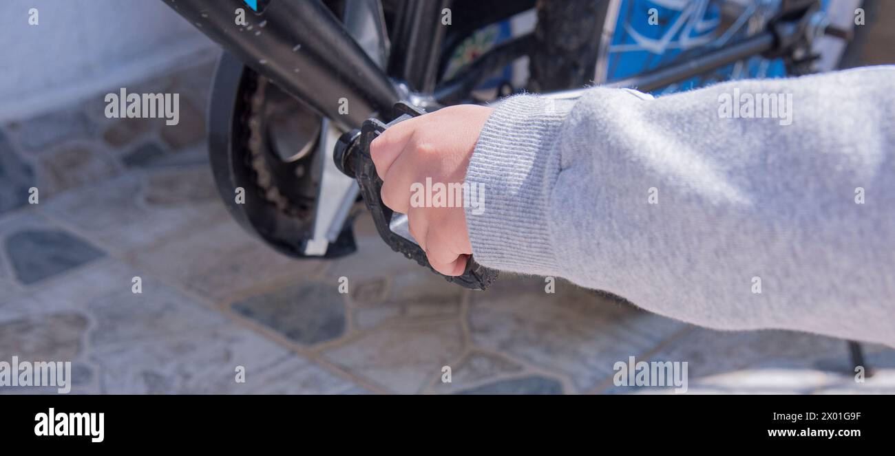 Child ringing bell on bike Stock Photo - Alamy