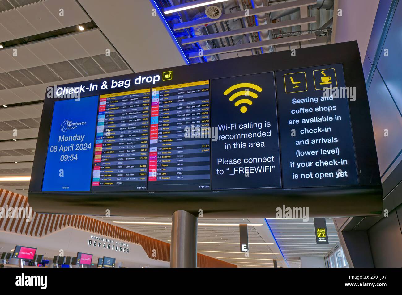 Airport information board at Manchester Airport's Terminal 2, England, UK. Stock Photo