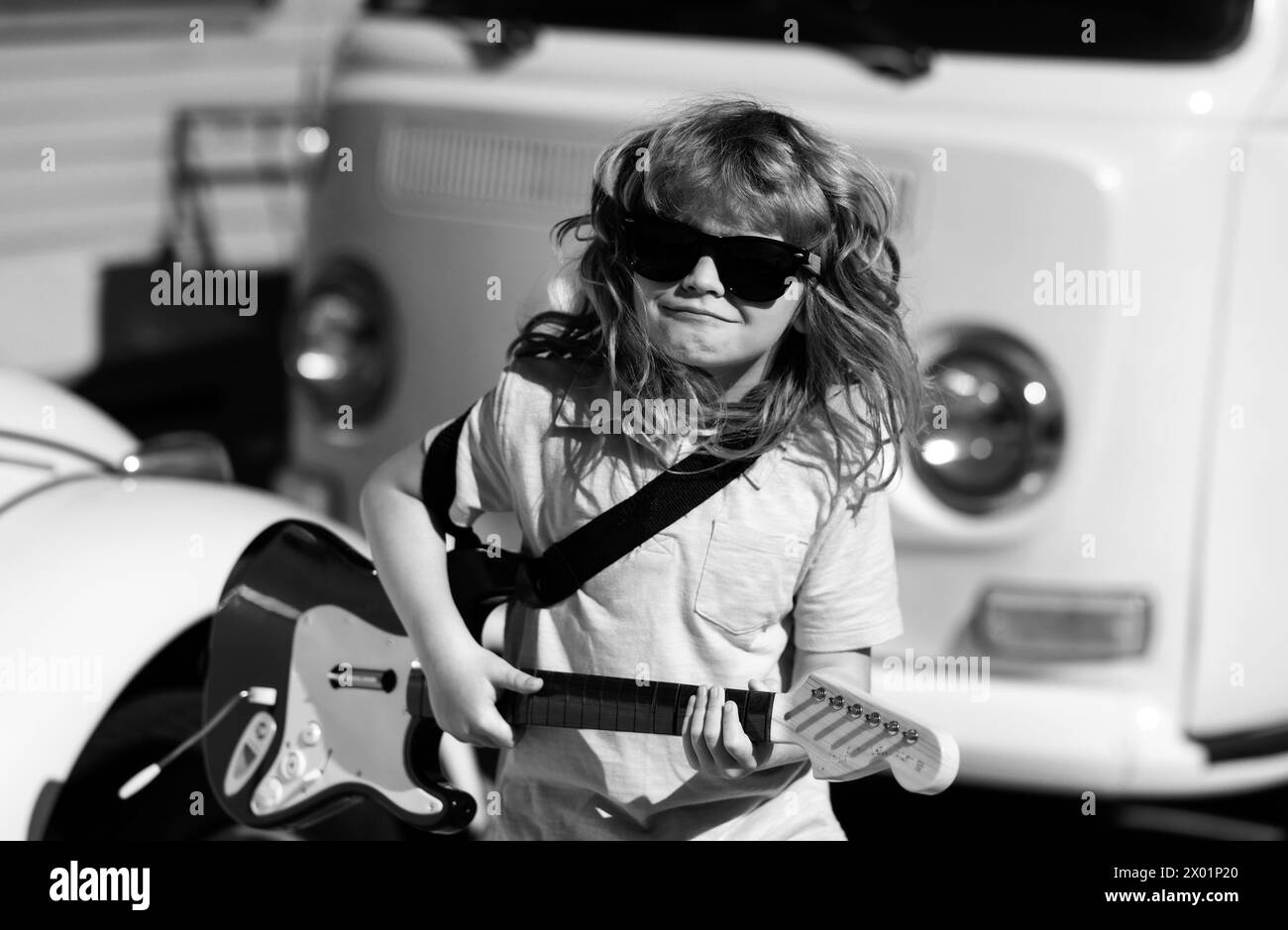Little boy playing guitar outdoor music for children stock photo alamy