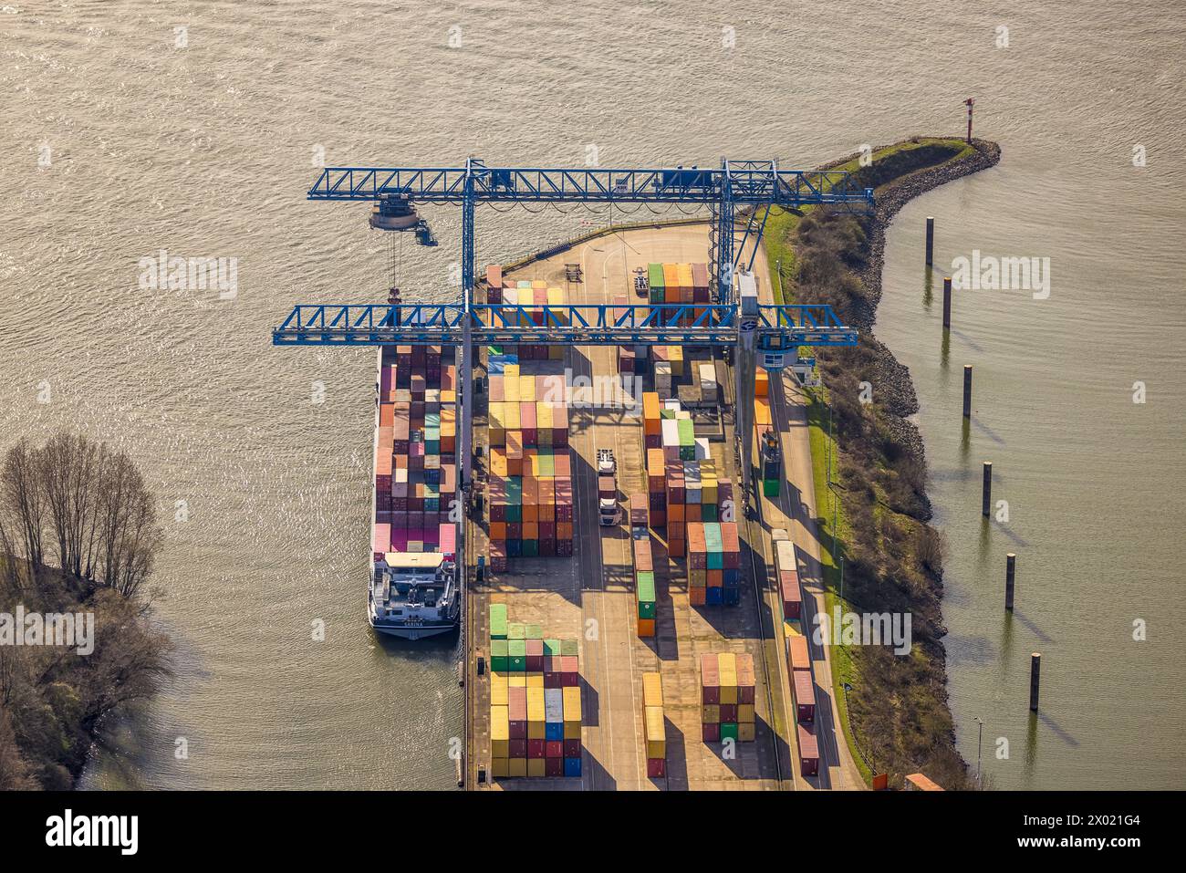 Aerial view, container port Emmerich and river Rhine, container ship and cargo crane for containers, Emmerich am Rhein, North Rhine-Westphalia, German Stock Photo