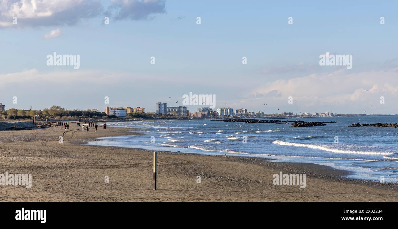 Porto Garibaldi, Comacchio,Italy: April 02, 2024 : Beach scene in Porto Garibaldi, Comacchio, Italy on a cloudy da Stock Photo