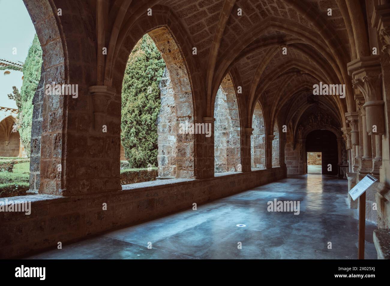 Captivating medieval monastery passage, perfect for historical and architectural themes. Stock Photo