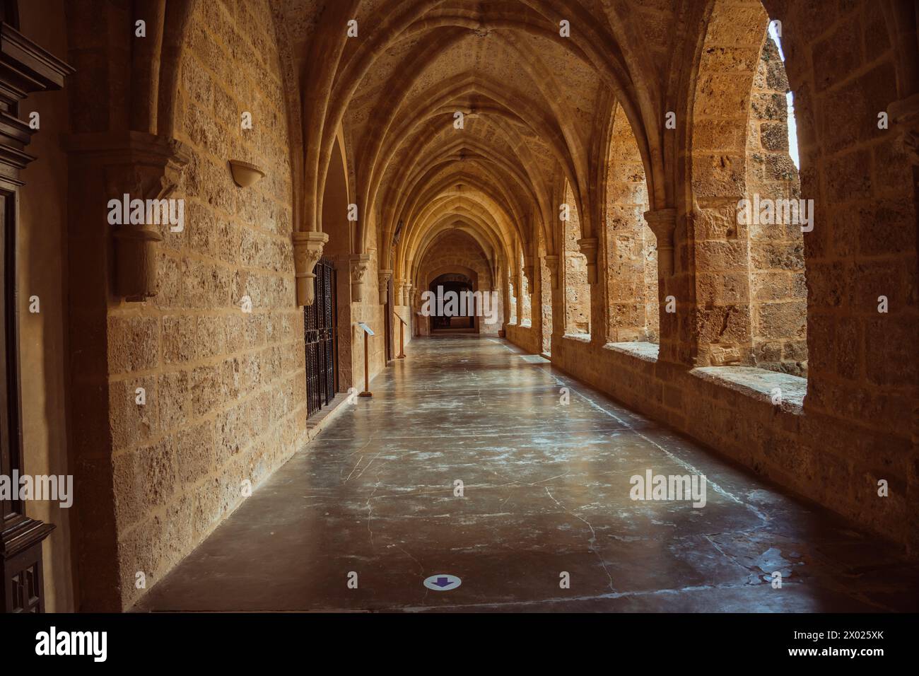 Captivating medieval monastery passage, perfect for historical and architectural themes. Stock Photo
