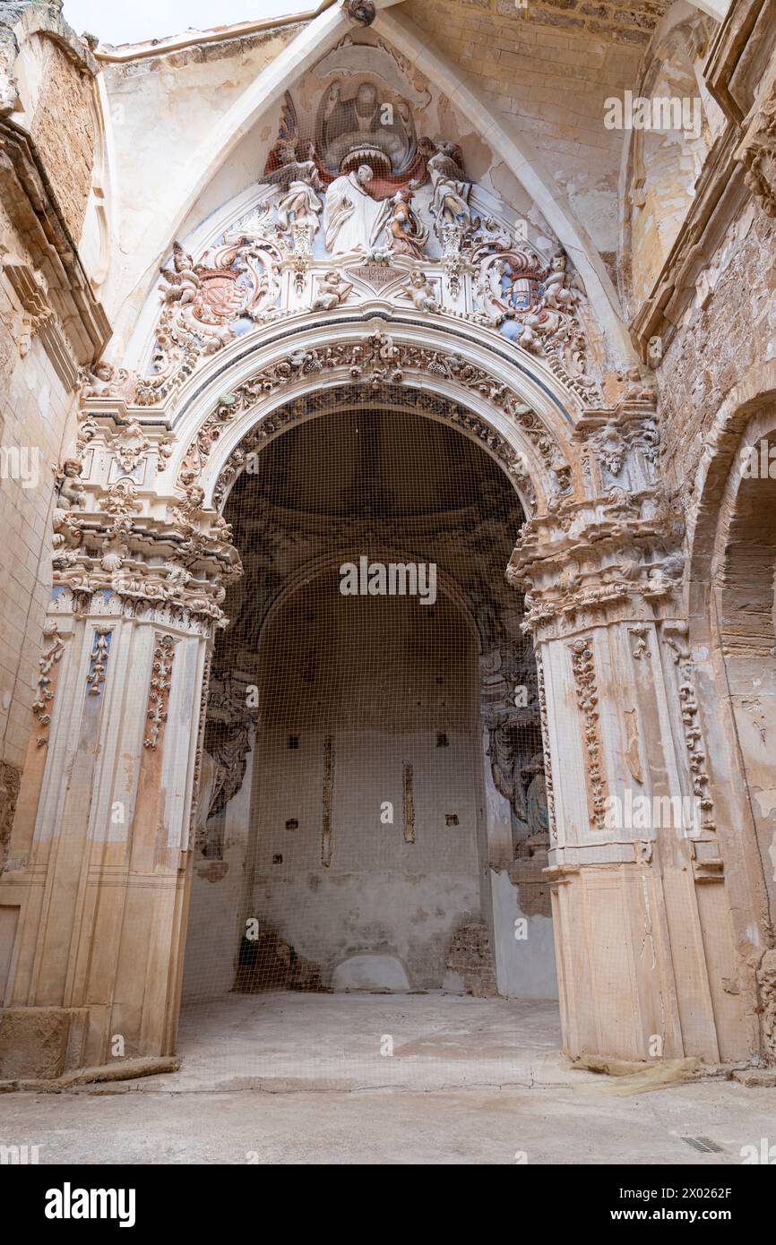 The complex Baroque portal stands resilient among the ruins of the Monasterio de Piedra, a testament to historic Spanish architecture. Stock Photo