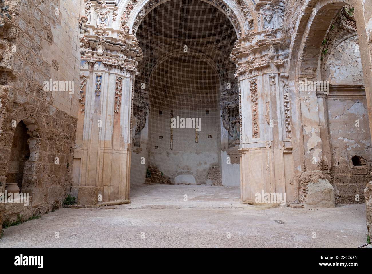 The Gothic apse and remains of an altar in the Monasterio de Piedra, framed by slender columns and lancet windows. Stock Photo