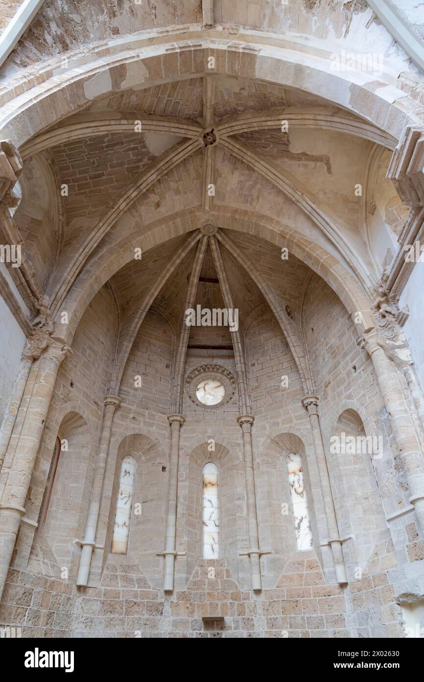 The Gothic apse and remains of an altar in the Monasterio de Piedra, framed by slender columns and lancet windows. Stock Photo