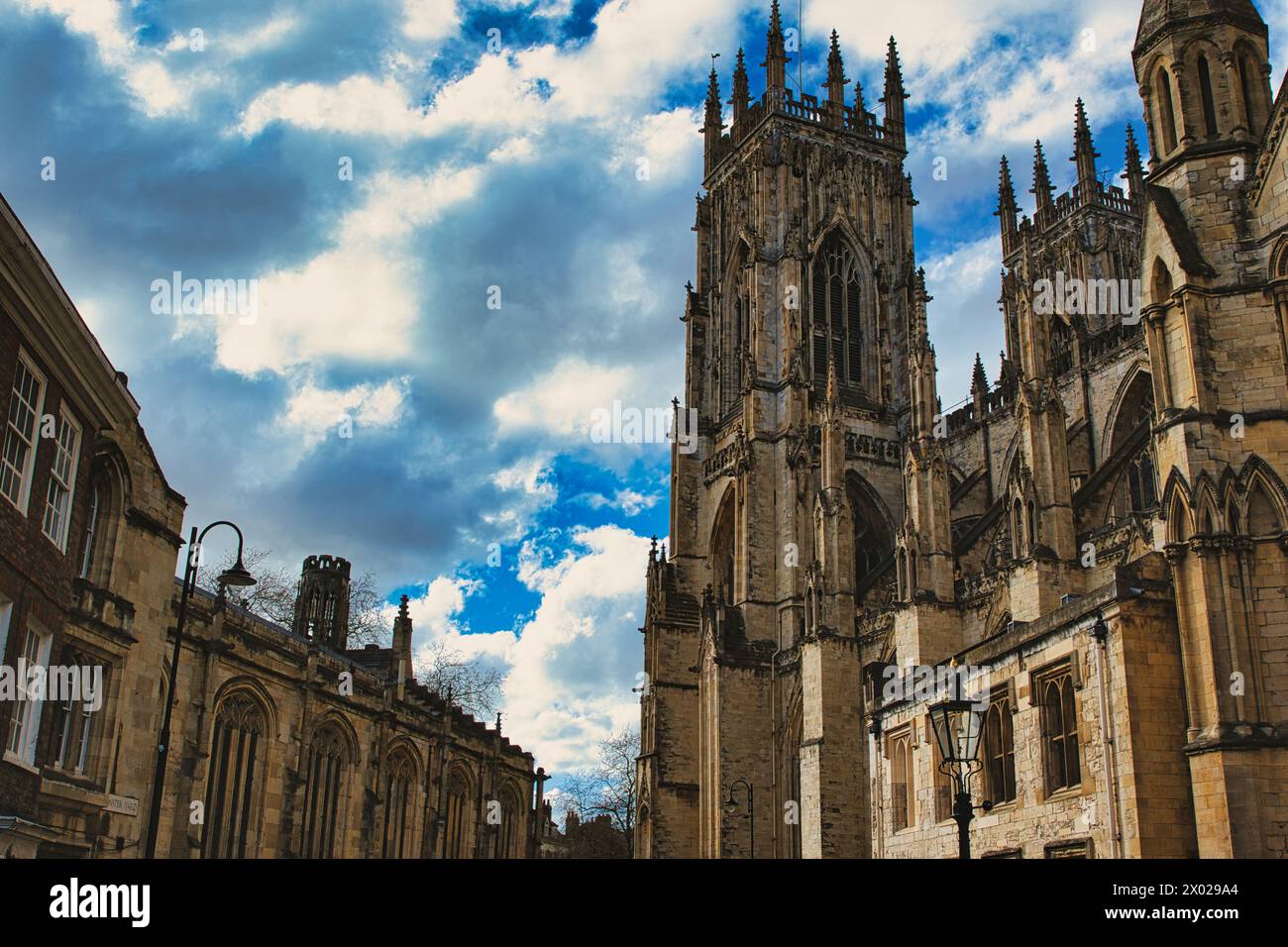 Dramatic sky over a majestic Gothic cathedral with intricate ...