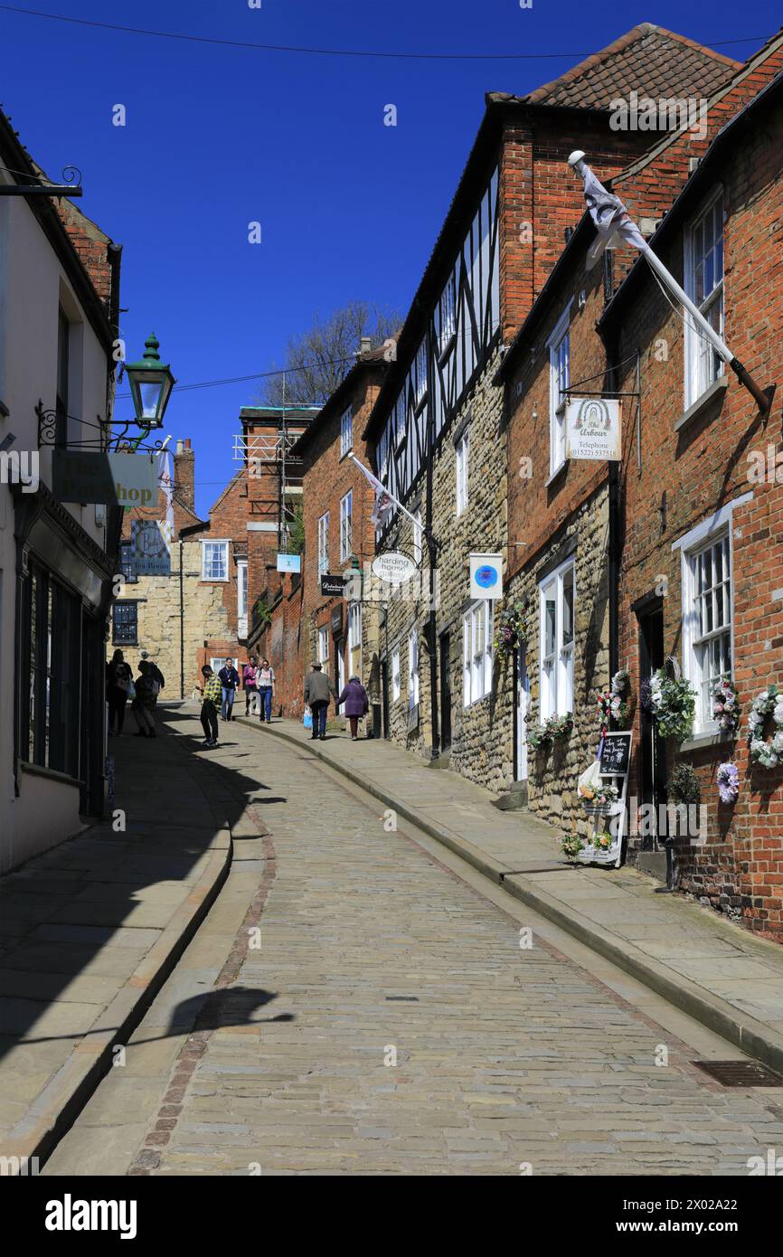 Shops and Cafes along Steep Hill, Lincoln City, Lincolnshire, England, UK Stock Photo