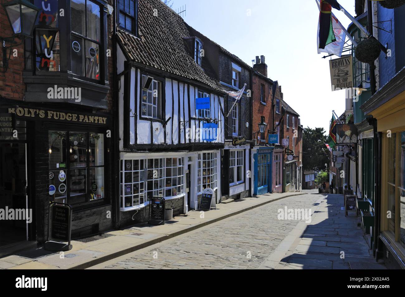 Shops and Cafes along Steep Hill, Lincoln City, Lincolnshire, England, UK Stock Photo