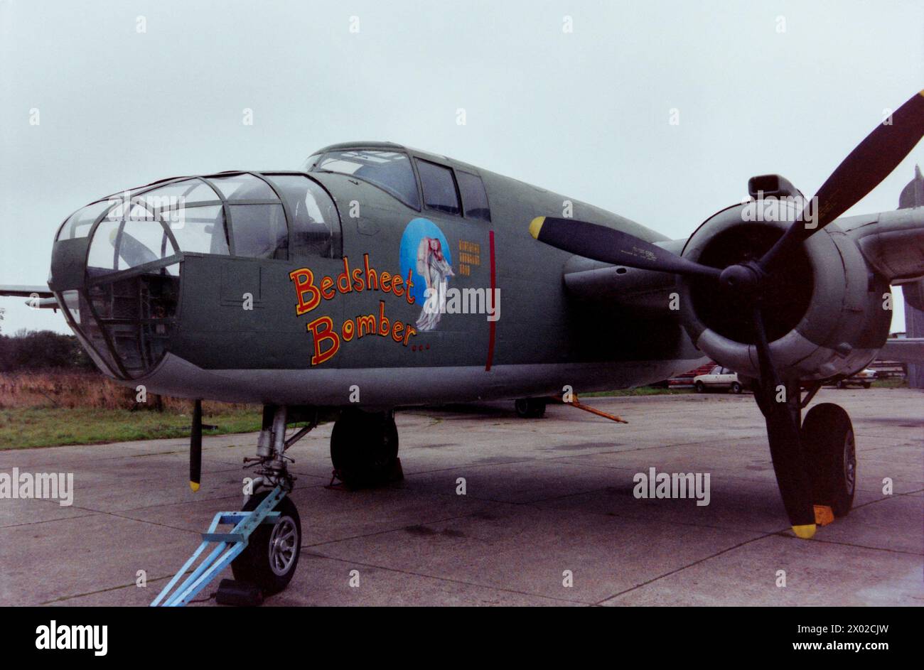 North American B-25 Mitchell Second World War bomber plane N9089Z named Bedsheet Bomber, seen at North Weald airfield in 1989. Delivered to the USAAF as 44-30861. Registered as N9089Z in 1959. To the UK for filming in 1963. Withdrawn from use at Biggin Hill in 1964. Moved to Southend for preservation in 1967. Moved to Duxford in 1984 after the museum closed then to North Weald in 1987. Stored outside from 1989 and became derelict. Moved to Wycombe Air Park in 2006 and stored in dismantled condition. Stock Photo