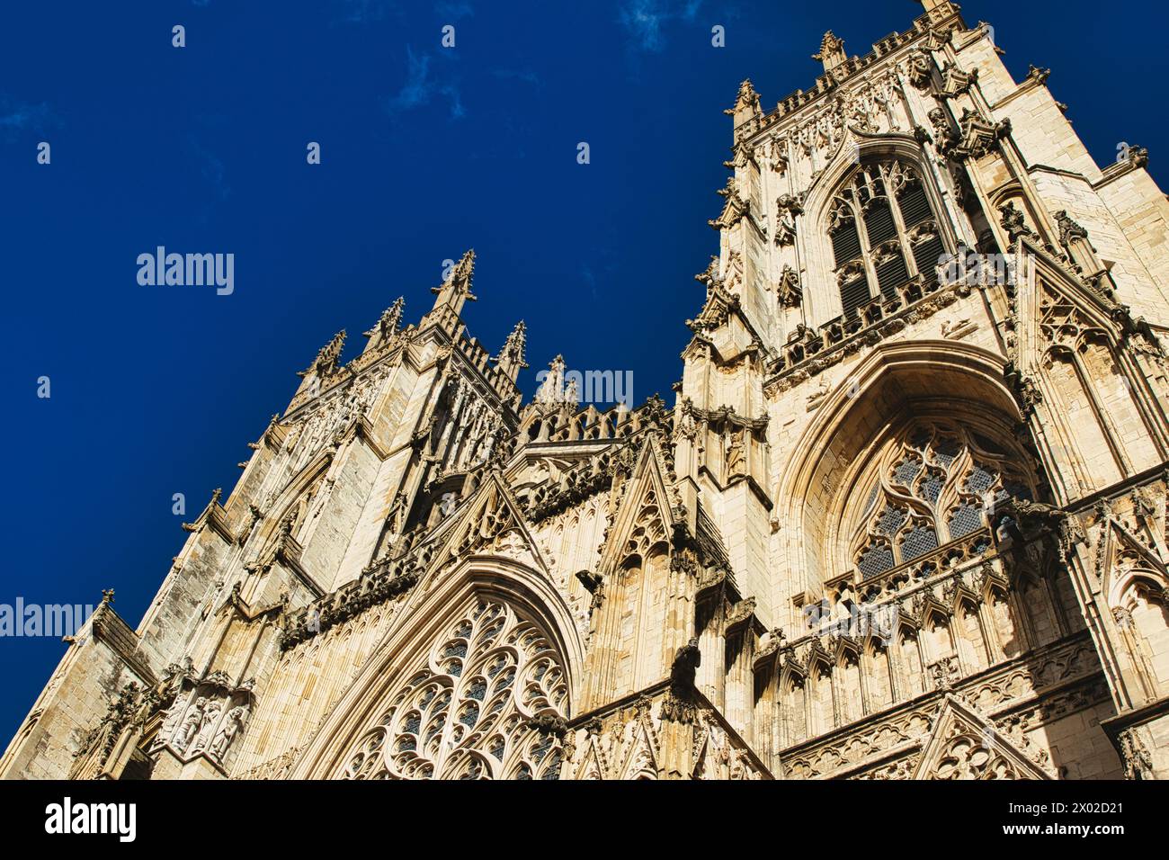 Gothic cathedral facade against a clear blue sky, showcasing intricate ...