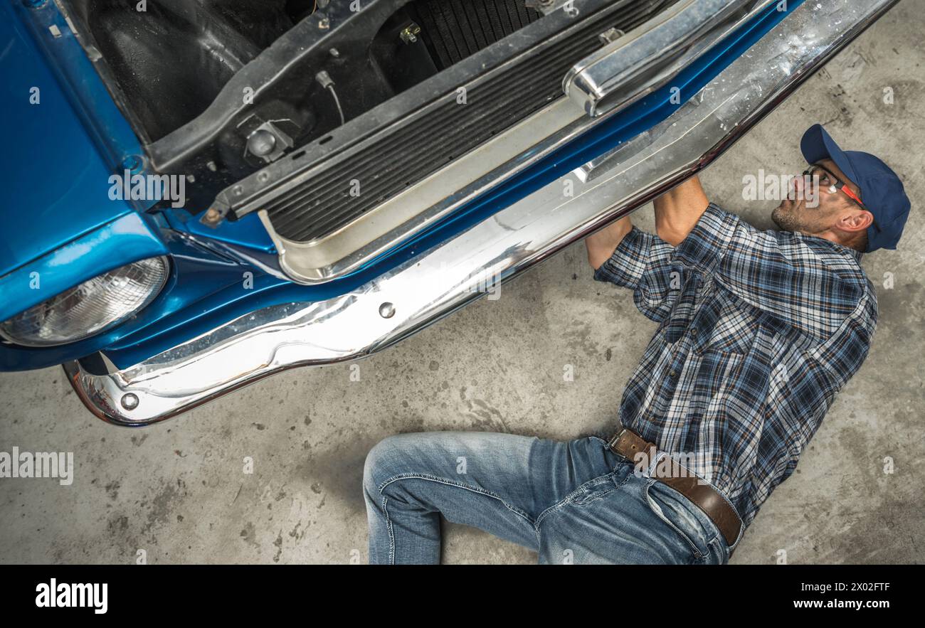 American Muscle Classic Car Renovation Performed by Caucasian Man Stock Photo