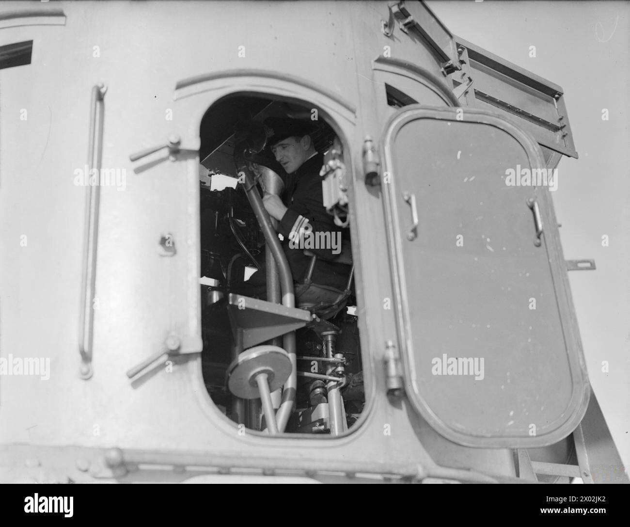 Lieut Cdr J J Casement, Gun Lieutenant, operated the director aboard ...